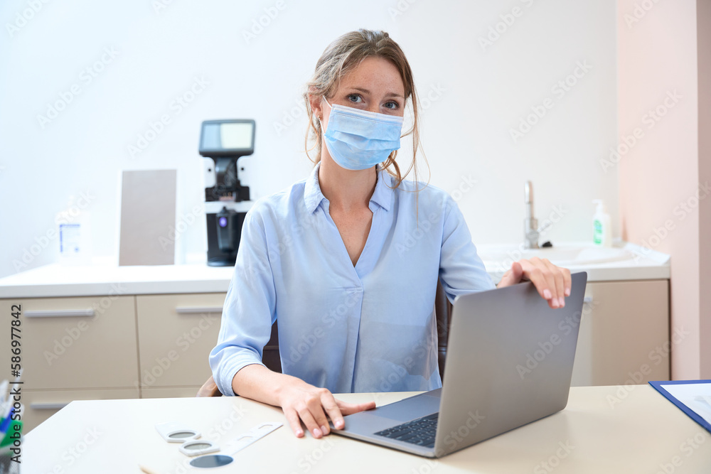 Beautiful woman is working at the computer in her office Beautiful woman is working at the computer in her office