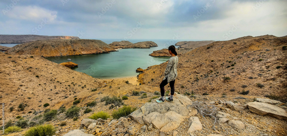 Tourist at the beautiful fjord in Bandar Al Khayran, Oman