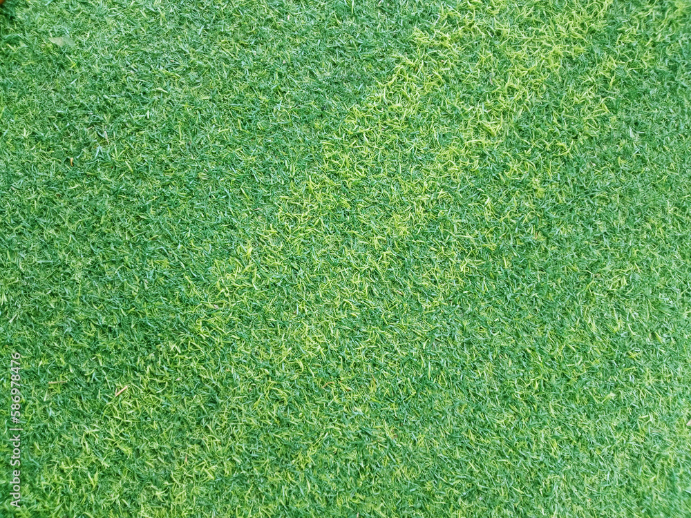Fototapeta premium Top veiw, Abstract blurred artificult turf green seamless texture for design, grass feild background, stadium floor