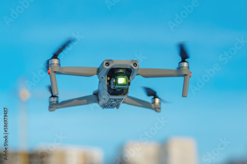 The drone flies against a blue sky. Aerial reconnaissance in Ukraine