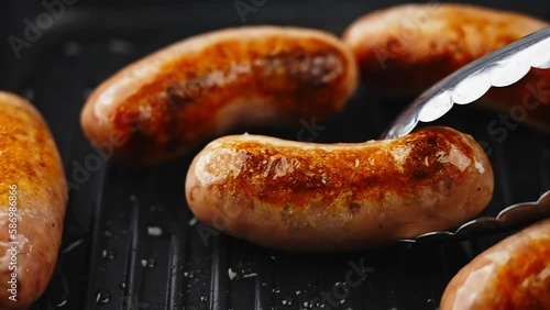 Delicious sausages are grilled on an electric grill