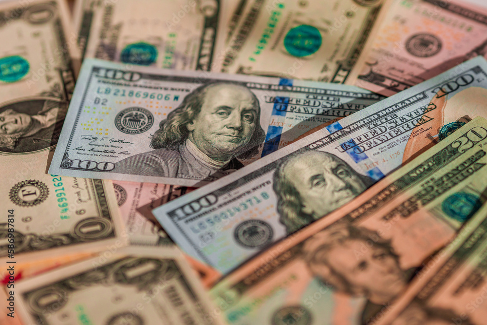 Scattered dollars obverse in view. The concept of inflation and banking problems in America
Scattered dollars obverse in view. The concept of inflation and banking problems in America