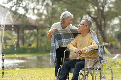 Elderly couple. Asian couple giving love to each other smiling happily. © amnaj