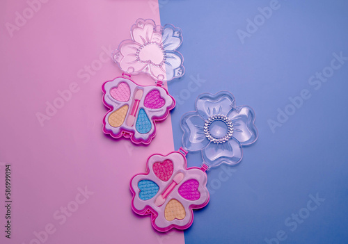 Children's set of decorative cosmetics for a little girl. Flat lay.