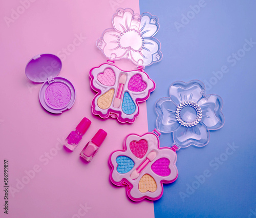 Children's set of decorative cosmetics for a little girl. Flat lay.