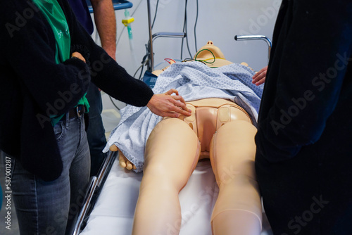 Nurses and emergency nurses undergo training at School of Medicine on emergency procedures and resuscitation. SimMan dummy in action.