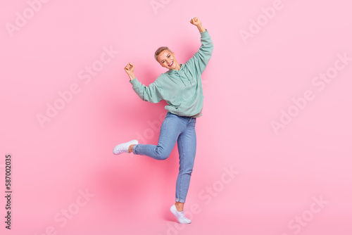 Full length photo of overjoyed lovely lady wear stylish clothes raise hand yes black friday empty space isolated on pink color background