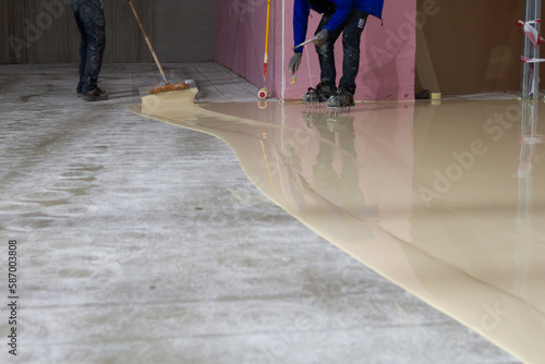 The worker who applied the resistant epoxy resin in the new hall was highly skilled and experienced in the application of epoxy coatings.  photo