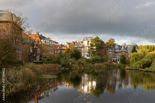 Beautiful Pond at Vondelpark with Colorful Trees and Buildings with Reflections during Autumn in Amsterdam South