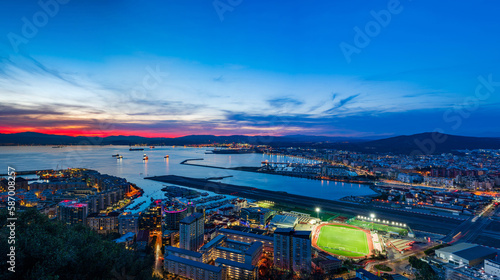 Sunset view over Gibraltar - a British Overseas Territory, and Spanish town of La Líinea de la Concepcion on Bay of Gibraltar