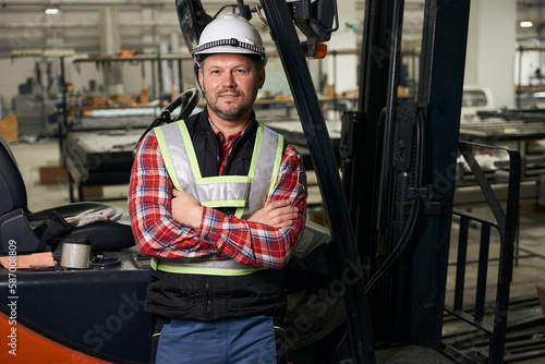 Portrait of male near loading truck at enterprise