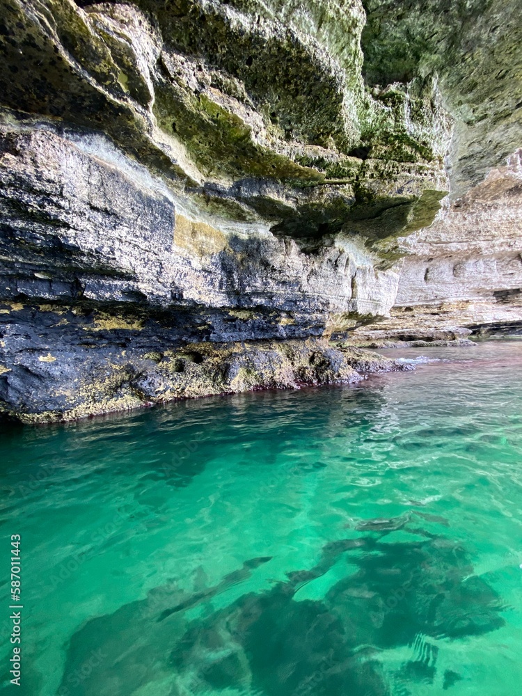 Rocky grotto with turquoise clear water, beautiful nature photo. Rocky grotto with turquoise clear water, beautiful nature photo.