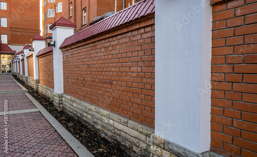 A brick wall on a bright sunny day.Stone fence.