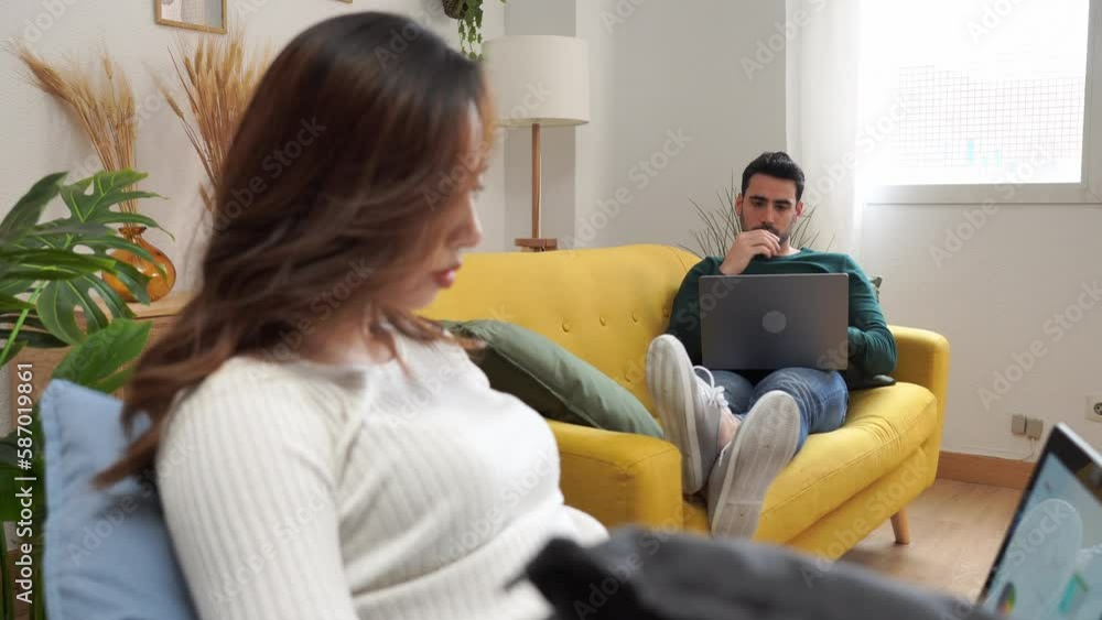Happy couple using laptop at home Happy couple using laptop at home