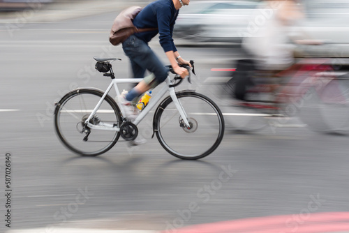 man on a racing bike in the city traffic © Christian Müller