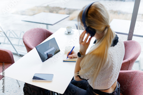 Businesswoman Yulia works remotely in a cafe photo