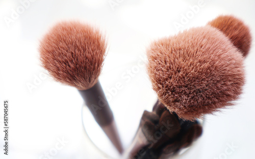 Close-up photo of makeup brushes on a white background.