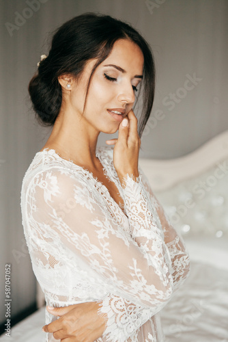 Young brunette woman boudoir in bride room