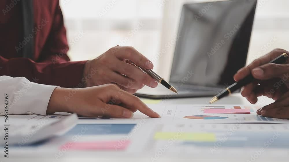 Financial analysts analyze business financial reports on a digital tablet planning investment project during a discussion at a meeting of corporate showing the results of their successful teamwork. Financial analysts analyze business financial reports on a digital tablet planning investment project during a discussion at a meeting of corporate showing the results of their successful teamwork.
