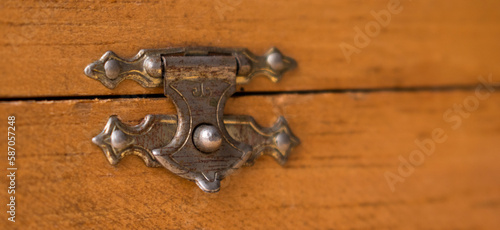 Close up of wooden chest metal latch