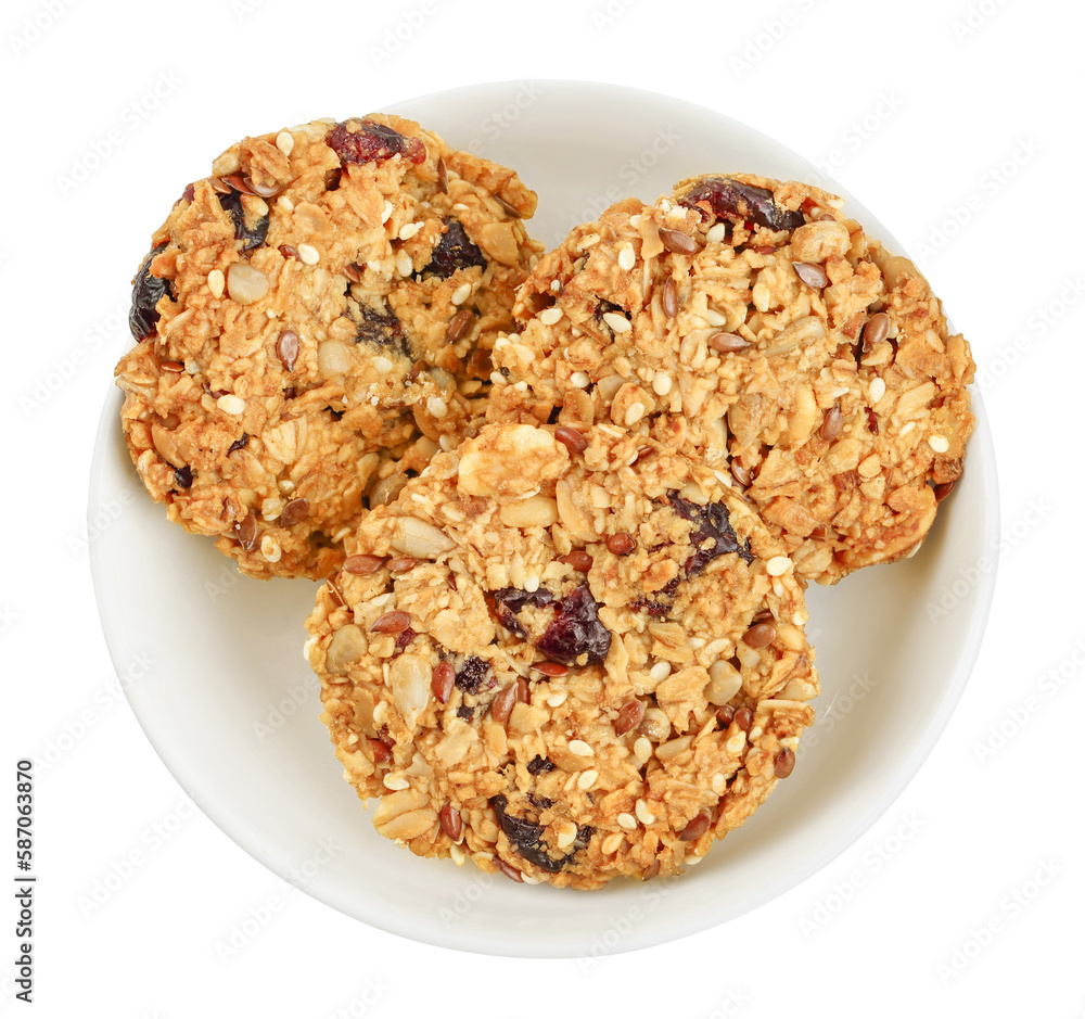 Granola cookie in ceramic bowl isolated on white background with full depth of field. Top view. Flat lay. Granola cookie in ceramic bowl isolated on white background with full depth of field. Top view. Flat lay.