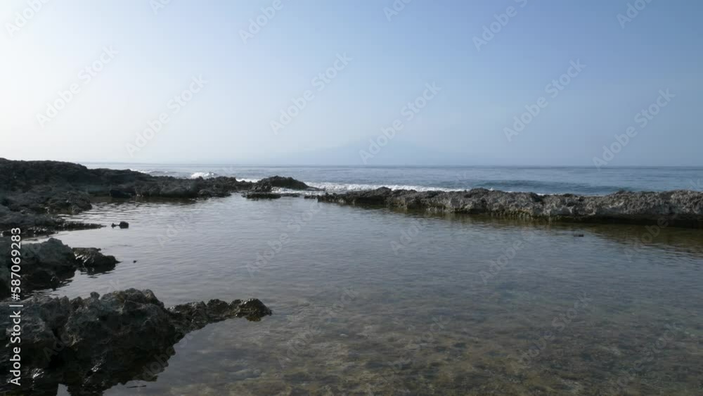 custom made wallpaper toronto digitalWaves breaking on the rocks. Etna volcano in the background. Sicily. Italy. Super slow motion 4K