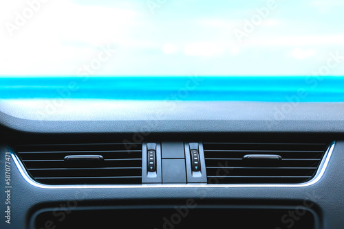 Modern car air vent front look against blue sky. Template for car accessories with air vent mounting. photo