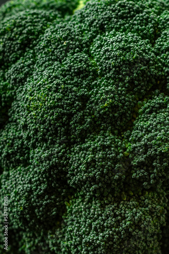 Raw fresh broccoli on a black home kitchen table