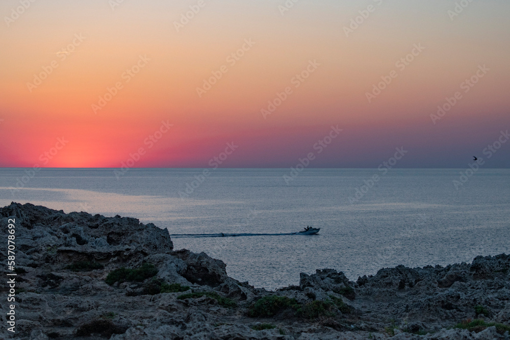 sunset over the sea with ship