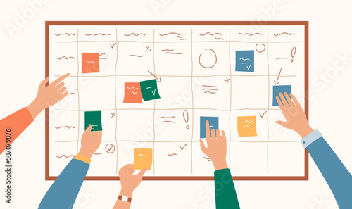 Task whiteboard concept. Hands glue multicolored square pieces of paper on board. Time management and organization of efficient workflow.