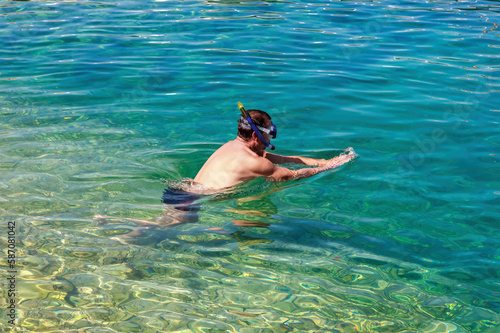 Swimming in a blue crystal clear watter