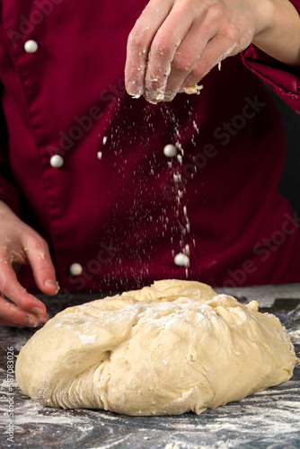 Professional cook makes yeast dough