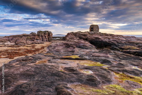 The Powder House at Seahouses on the Northumberland coast, with a dramatic morning sky. photo