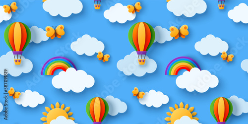 Seamless pattern beautiful fluffy clouds on blue sky background with summer sun, butterfly, hot air balloons and rainbow. Vector illustration. Paper cut style.