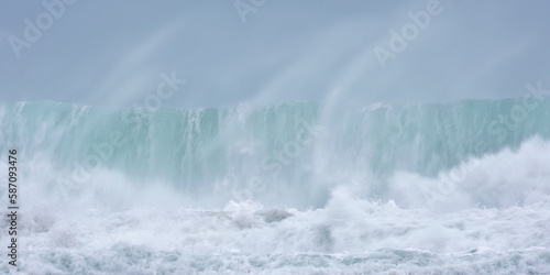 crashing waves off chapel Porth beach Cornwall UK 