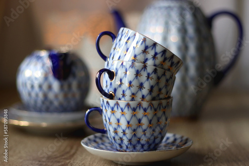 Vintage blue and white tea set on the table. Selective focus. photo