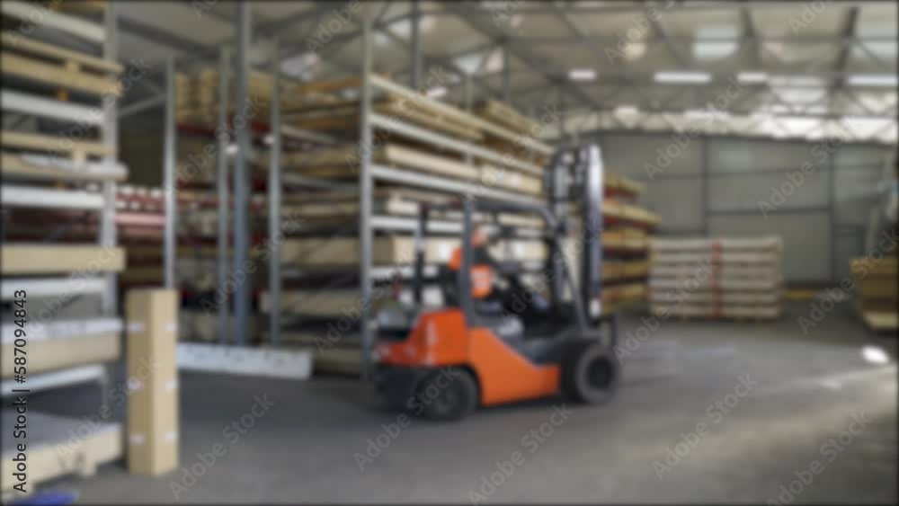 Background blur video of a forklift working in a warehouse. Background blur video of a forklift working in a warehouse.