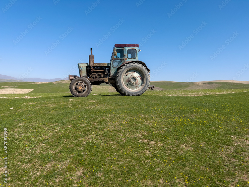 An old soviet machine on the meadow. An old soviet machine on the meadow.