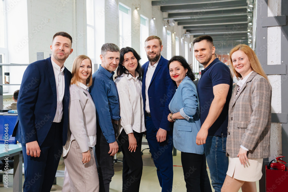 a group of men and women in coworking. the concept of teamwork. a group of men and women in coworking. the concept of teamwork.