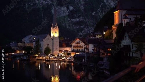 Female is walking in Hallstatt nature and enjoy at the moment at night time 