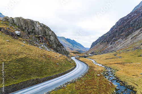 Concrete road through Snowdonia National Park in Wales. Travelling by car through the UK. High quality photo