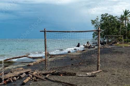 beach of Cocles on the Caribbean side of Costa Rica, Puerto Viejo de Talamanca with an handmade soccer coal made of palm trees