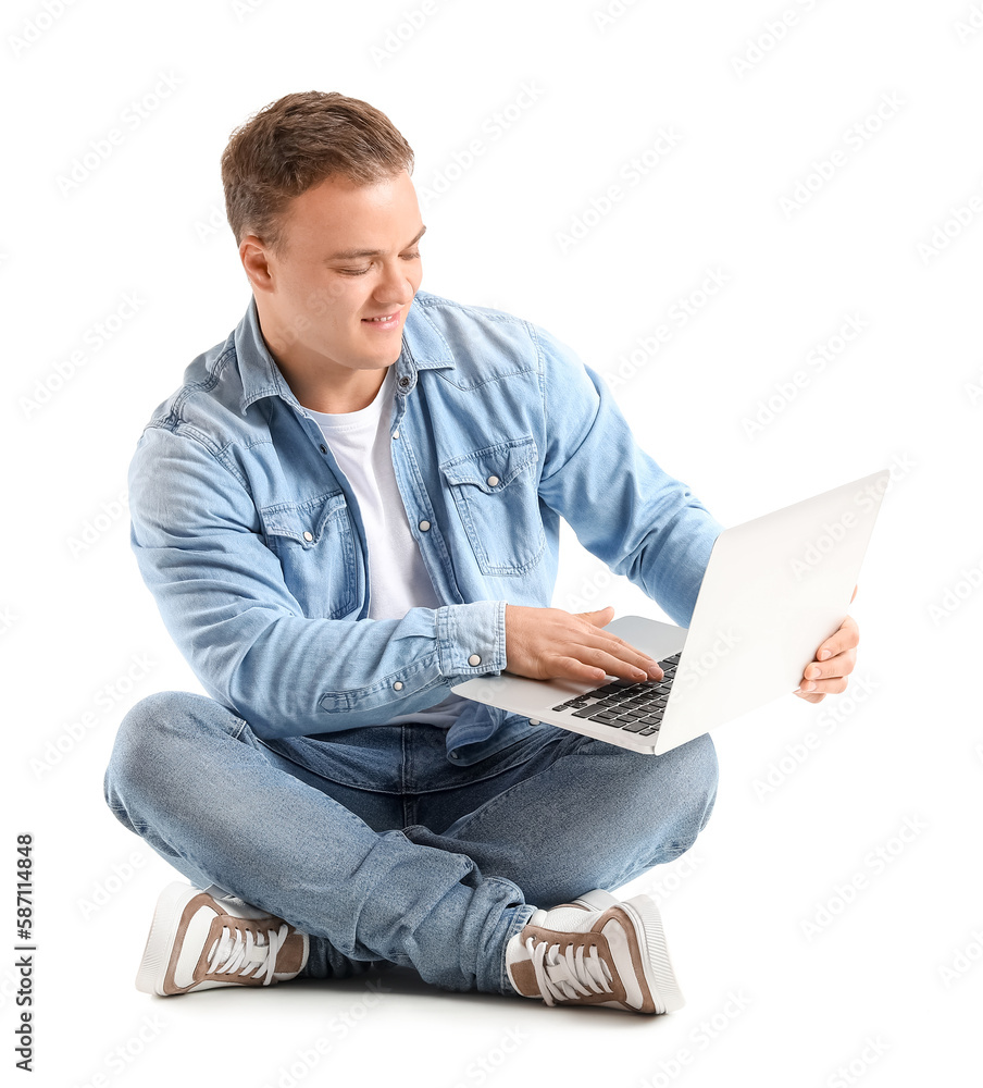 Young man using laptop on white background Young man using laptop on white background