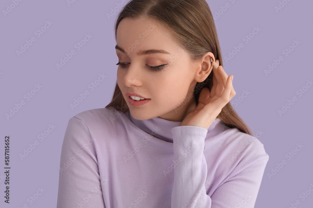 Young woman in sweater touching hair on lilac background, closeup Young woman in sweater touching hair on lilac background, closeup