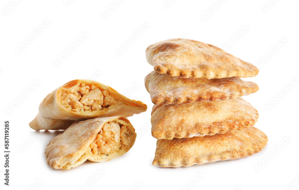 Stack of baked meat empanadas on white background