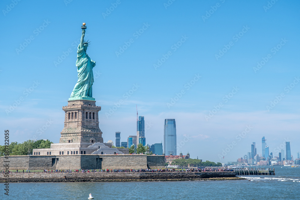 Statue of Liberty during sunny day in New York. Symbol freedom of the USA.