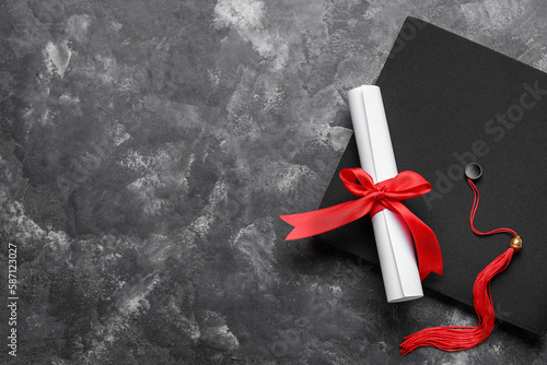 Diploma with red ribbon and...