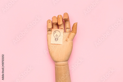 Wooden hand and sticky pape...