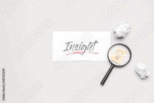 Word INSIGHT, crumpled pape...
