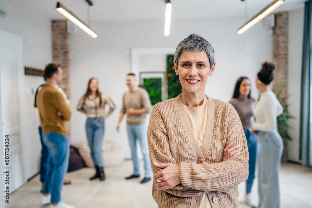 woman caucasian female in front of group of people happy smile at work